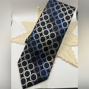 Michael Kors Men's Tie. Blue Black tan cream outlined circles; black background